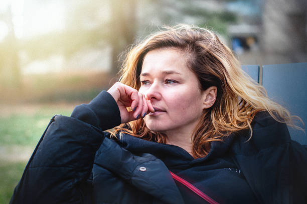 istock Contemplative moment during spring journey. Traveler pauses thoughtfully while exploring suburban New Jersey with companions. 2216923422