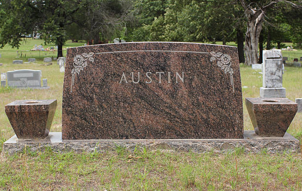 istock Headstone in Cemetery With Word Austin. Death Concept 2216925793