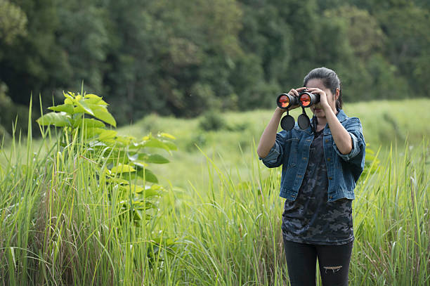 istock Female birdwatching/hiking  in nature concept 2216925864