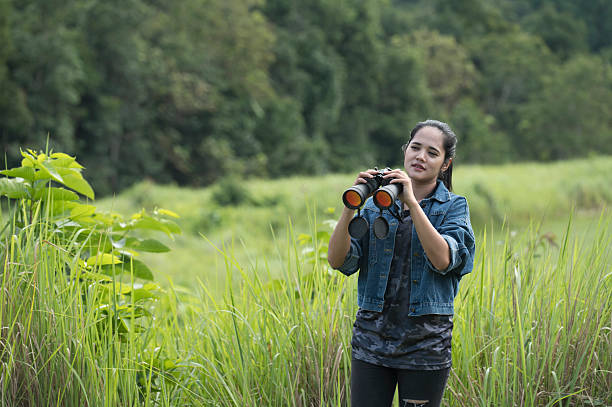 istock Female birdwatching/hiking  in nature concept 2216925873