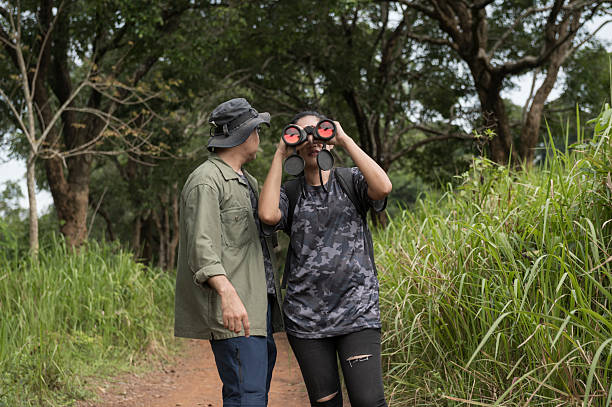 istock Female birdwatching/hiking  in nature concept 2216926389