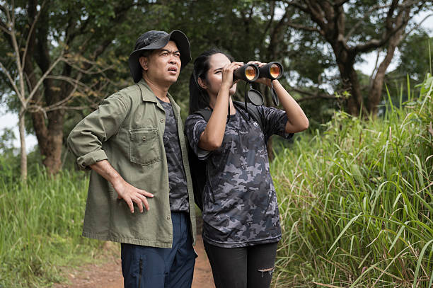 istock Female birdwatching/hiking  in nature concept 2216926390
