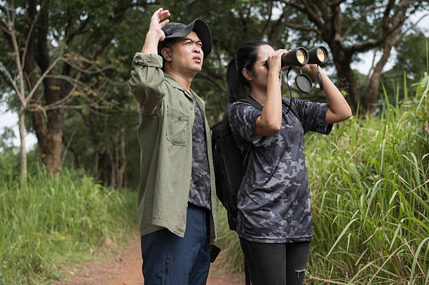 istock Female birdwatching/hiking  in nature concept 2216926392