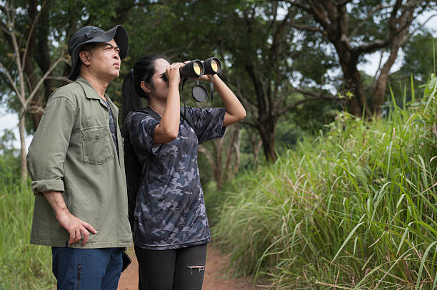 istock Female birdwatching/hiking  in nature concept 2216926394