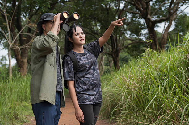 istock Female birdwatching/hiking  in nature concept 2216926395