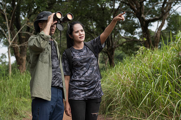 istock Female birdwatching/hiking  in nature concept 2216926400