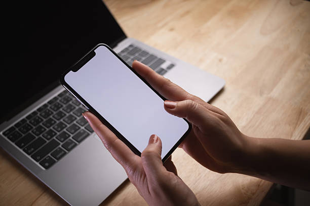 istock Woman using smartphone during on laptop computer at office, social network. 2216927349