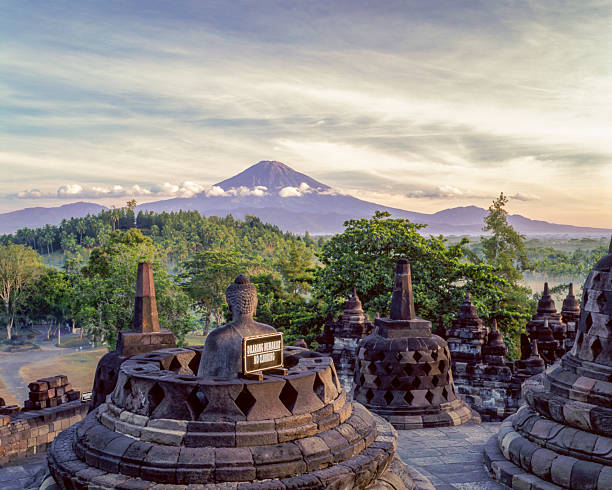 istock Buddha Statues and Stupa on the Second Terrace of Borobudur and Mount Sundoro, Central Java, Indonesia 2216930195