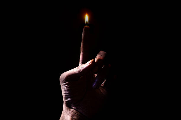 istock Finger Flame Concept in Darkness ,Surreal Human Fire Symbolism 2216930645