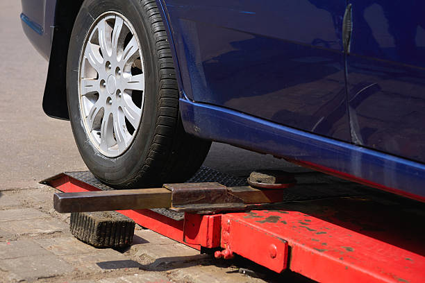 istock Automobile car on lift for changing wheel,auto repair 2216931181