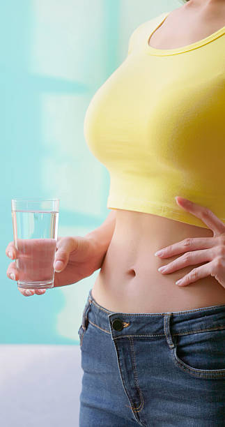 istock Woman promote water benefit gut 2216931728