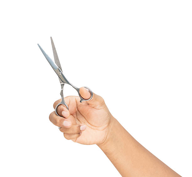 istock Clipping path, Hand holding hair scissors on white background. 2216932116