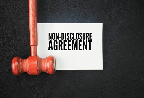istock Judge's gavel and white paper with the words non-disclosure agreement. 2216933656