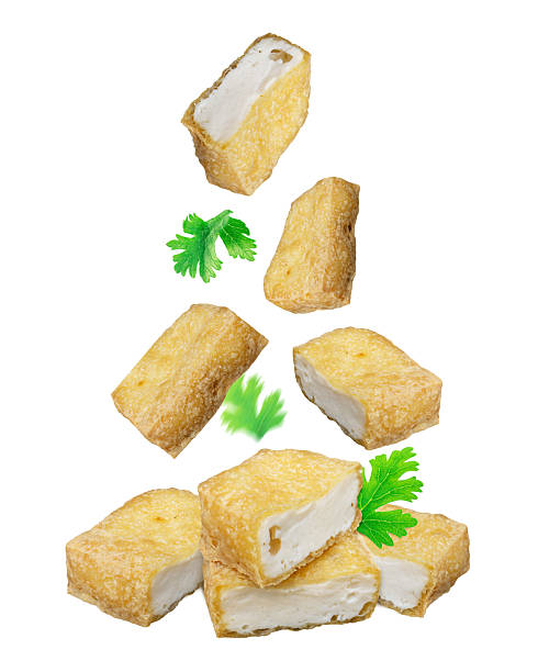 istock Crispy golden pieces falling on a white clean background 2216934779