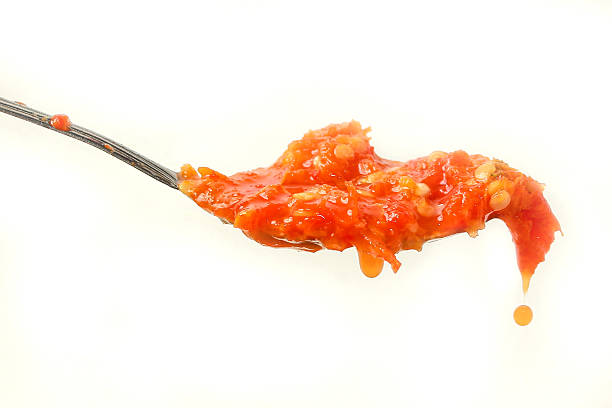 istock a spoonful of chili sauce isolated on a white background 2216938047