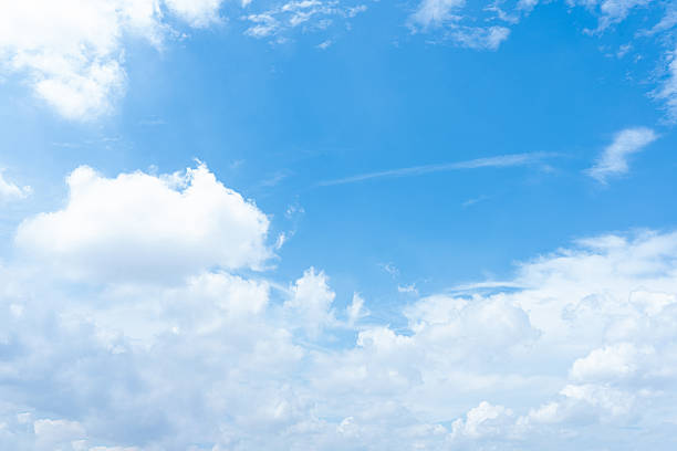 istock Serene Summer Sky Blue Sky with Fluffy White Clouds Background Image 2216940782