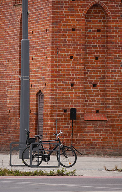 istock Bicycle parked against red brick building. 2216945124