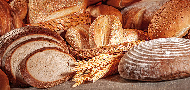 istock Fresh baked bread. Assorted bakery products loafs of bread and rolls... 2216946494