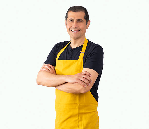 istock salesman wearing yellow apron 2216951103