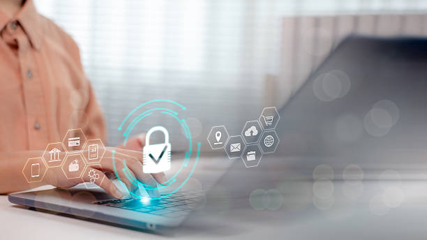 istock Close-up of hands typing on laptop with virtual cyber security interface, digital lock icon, and network symbols. Concept of data protection, privacy, and secure online transactions. 2216951481