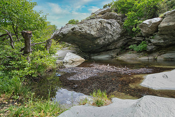 istock Small Waterfall in Lush Forest on Andros Island, Greece 2216952663