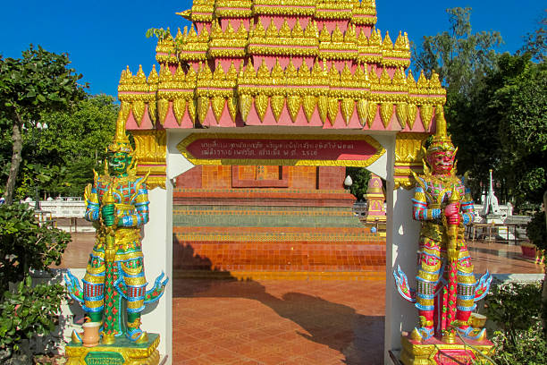 Colorful guard Yaksha statue in a Buddhist temple Wat in Thailand. Golden Statue guardian sacred creatures mystical and mythological relic of Thai Buddhism religion. Decoration of thai buddhist pagoda