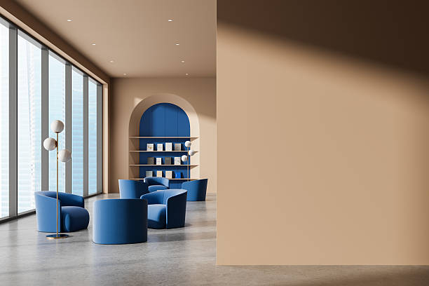 istock Modern interior with blue chairs and empty beige wall ideal for poster mockup in clean architectural layout with abstract design concept. 3D Rendering 2216954670