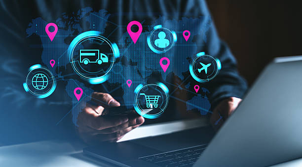 istock Digital logistics icons over world map with person using smartphone and laptop in dark setting. 2216954721