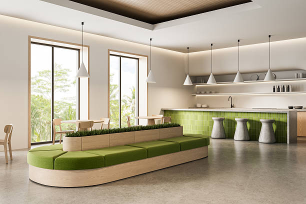 istock Modern minimalist interior with green seating and tiled kitchen area in open space with natural lighting and wood accents throughout the design. 3D Rendering 2216954886