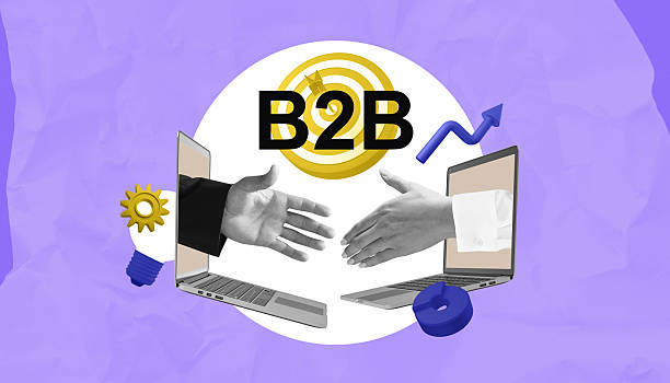 istock B2B handshake through laptops with gear and arrow icons on purple background. 2216954936