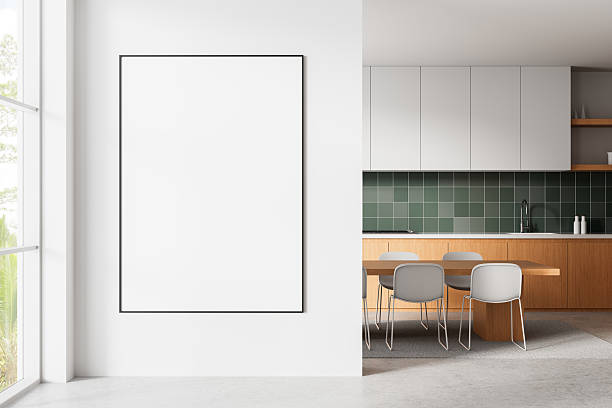 istock Modern interior kitchen with large blank poster frame on white wall for mockup or advertising design template presentation in bright clean space. 3D Rendering 2216955828