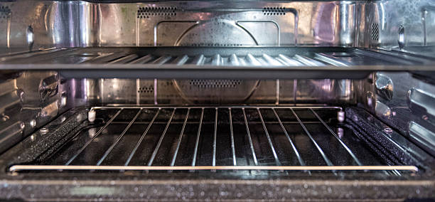 istock Stainless oven close-up with empty rack and tray, macro detail 2216957106