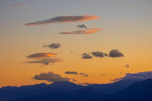 Greek mountains of Thessaly. Sunset clouds over mountain silhouettes