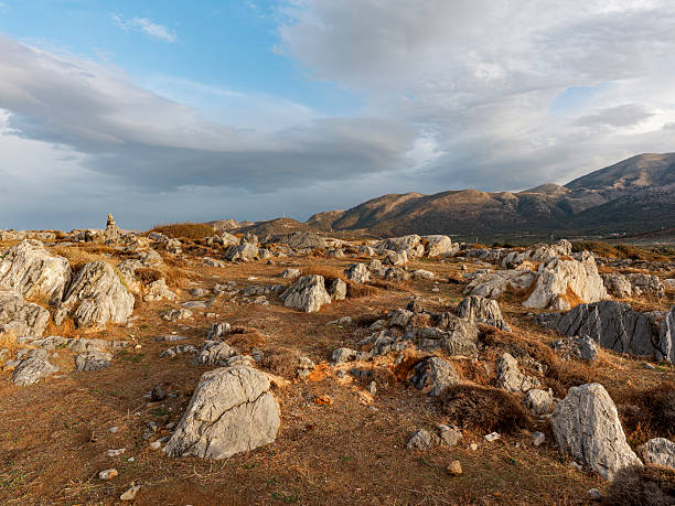 Discover Malia, Crete’s stunning rocky landscape and dramatic skies, showcasing nature's raw beauty.