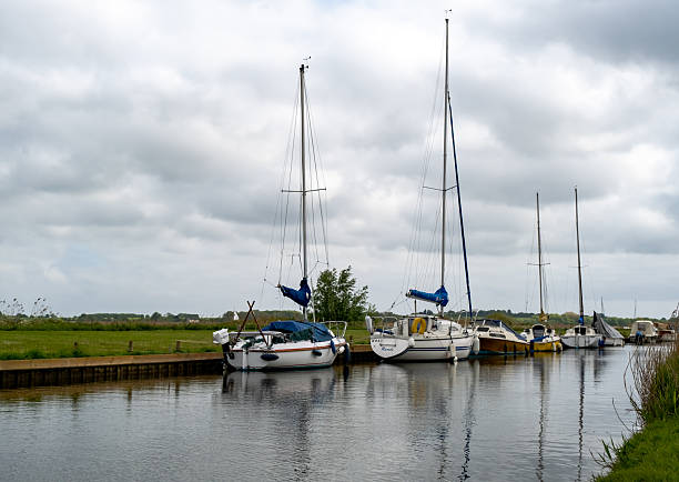 Upton, Norfolk, UK  May 18 2025. Leisure boats and pleasure boats moored in Upton Dyke, Norfolk Broads