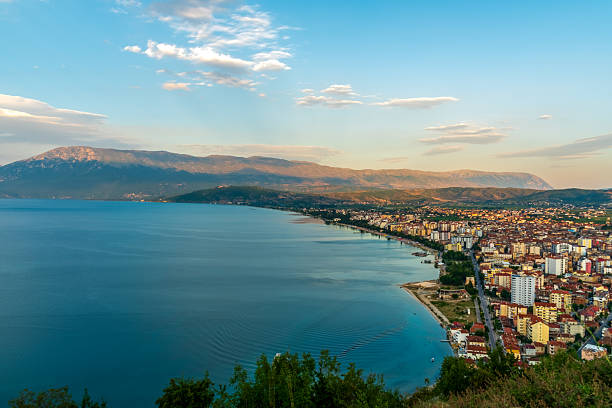 Pogradec sweeps along Lake Ohrid in southeastern Albania, unveiling a vibrant waterfront, hillside neighbourhoods, and a panoramic Balkan backdrop