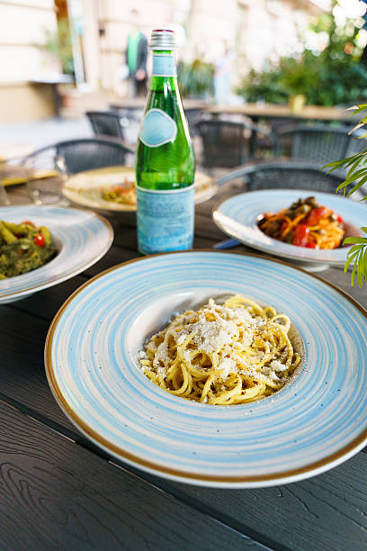 istock Italian pasta dishes served with sparkling water 2216966054