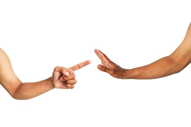 istock Conflict scenario with gestures: pointing finger versus outstretched hand denial 2216968221