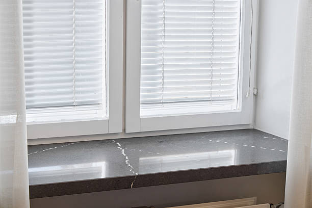 istock An Elegant Window Sill adorned with Modern Blinds that invite Natural Light into the room 2216968517