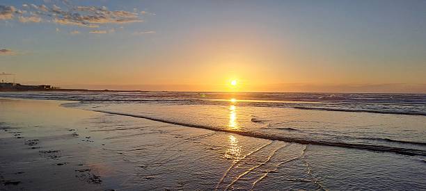 istock Golden sunset illuminating tranquil ocean waves 2216969633