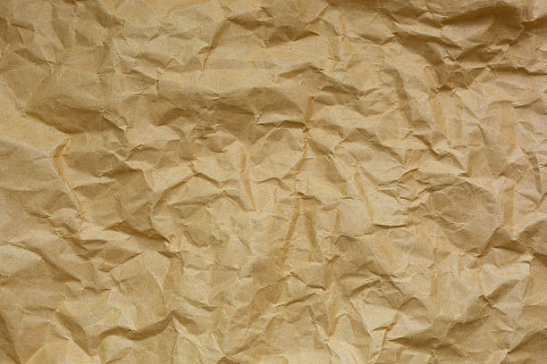 istock Macro brown crumpled paper texture,Brown crumpled paper texture for background 2216970187
