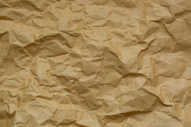 istock Macro brown crumpled paper texture,Brown crumpled paper texture for background 2216970188