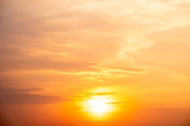 istock Sky,Beautiful sunset view, luxury soft gradient orange gold clouds and sunlight on the blue dramatic sky perfect for the background, morning, evening,Twilight, climate change,horizontal sunset photo 2216970202