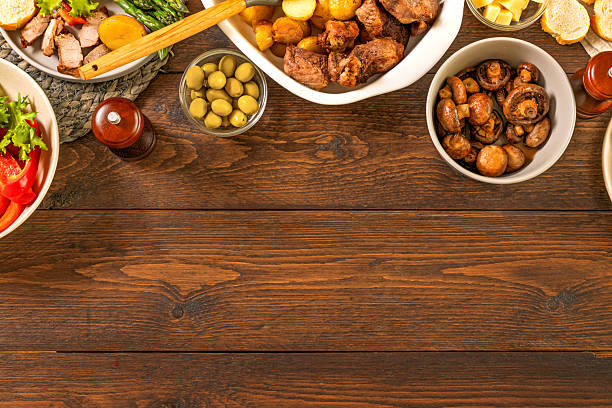 istock Family dinner table with meat potatoes vegetables 2216971540