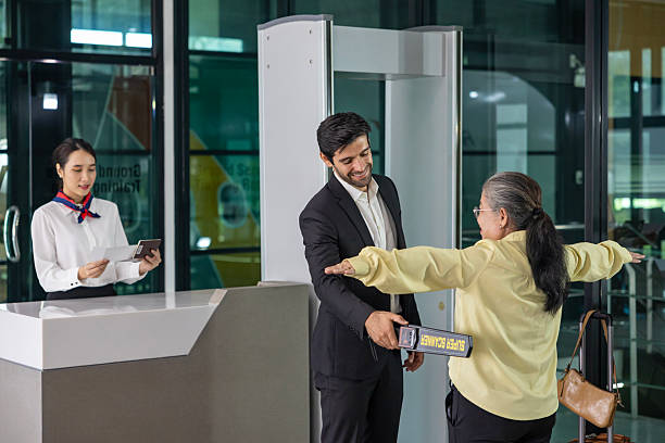 istock Airline ground staff is using metal scanner for security check every passenger in the airport departure terminal for safety protocol before boarding into plane 2216974140