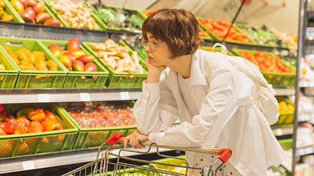 istock Depressed woman in store 2216974667