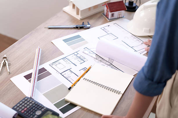 istock Architectural Design Blueprint on Desk with Tools and House Model for Interior Project Review Drafting Blueprint Design Idea Modern Studio 2216976534