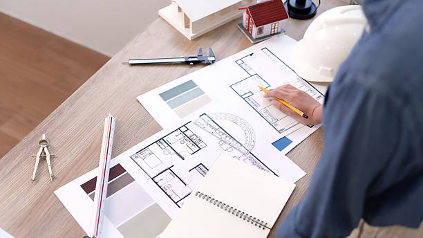 istock Architect Design Blueprint Asian Adult Hand Drawing Home Plan for Construction Engineering Success and Innovative Ideas Planning Architect Working on Design Blueprint 2216976535