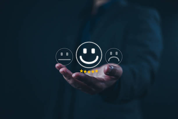 istock Customer satisfaction survey concept. User give five-star rating to service experience, Businessman shows smile icon on hand and 5 star, customer, satisfaction, user 2216976923