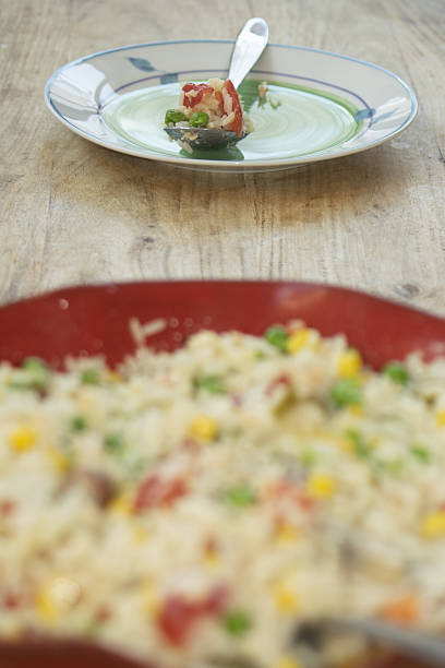 Rice salad with tomatoes, sausage and onions, italy